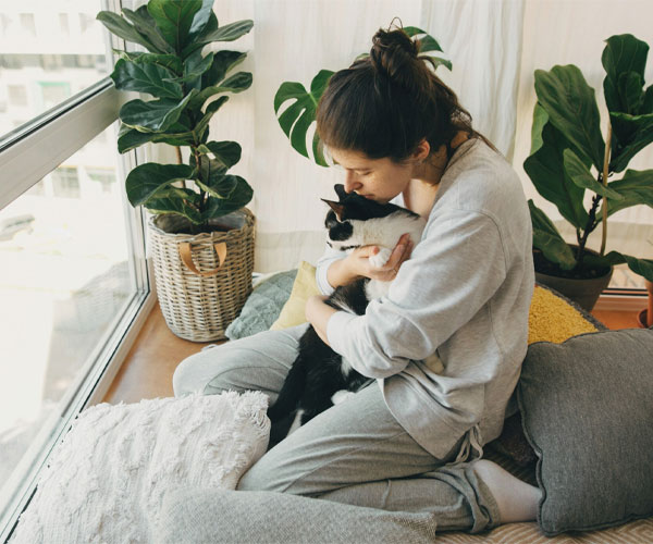 Girl hugging a cat